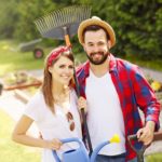 Young couple working in the garden